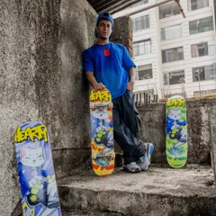 Posing with the finished Hearty Skateboards collaboration decks. We shot these in a gritty, urban location that perfectly matched the vibe of the artwork.