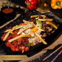 Get ready for a flavor explosion with our Chicken Hungama Sizzler. This platter features three different appetizers, like chili chicken and creamy chicken, served together on one sizzling plate.