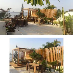 This sea facing residential terrace was designed to be the perfect spot to enjoy a Mumbai sunset. We installed a wooden deck and pergola for a cozy seating area, along with a dining space and carefully selected salt-tolerant plants.