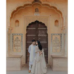 A kiss against a backdrop of history. This pre-wedding portrait in Jaipur uses the magnificent, earthy tones of the city's architecture to create a romantic and culturally rich image.