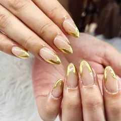 This is my take on the classic French manicure, elevated with liquid gold chrome. I use builder gel for strength and durability, then hand-paint these molten gold accents for a finish that whispers pure luxury.