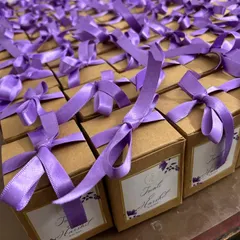 A sea of purple! We love how these custom-packaged wedding favors turned out. Each box contains a beautiful scented candle to thank the guests.