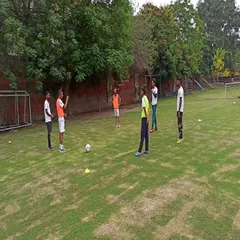 A practical session during a YDFA coaches workshop. Our coaching staff actively participates in drills to better understand the techniques they teach our players.