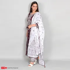 We capture the fine details of ethnic wear, as seen in this side-profile shot of a model in an embroidered kurta set. The focus is on the fabric, pattern, and overall silhouette.