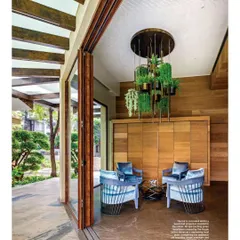 This space was designed to be an extension of the garden. The large, foldable glass doors allow the entire room to open up to the patio, creating one large, seamless area for entertaining that is both indoors and outdoors.