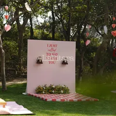 A creative and interactive photo booth with the phrase "I just called to say I love you" and two vintage telephones. This playful installation provided a unique and memorable activity for guests.