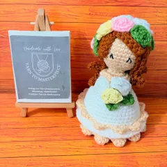 This is where a little magic happens. My reversible doll starts as a beautiful character holding a small bouquet and flips inside out to become a full, everlasting arrangement of crochet flowers. It's a truly unique keepsake.