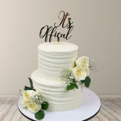 It's official! This two-tiered cake with a rustic textured buttercream finish and fresh white roses is perfect for an intimate yet elegant wedding or engagement party.