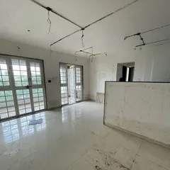 Before: An empty living area with plain walls and basic flooring. A blank canvas awaiting a story.