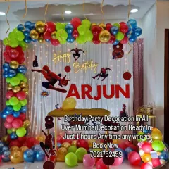 Your friendly neighborhood Spider-Man is swinging into the party. This action-packed theme features a red, blue, and gold balloon arch, multiple Spidey cutouts, and a personalized name banner for the birthday boy, Arjun.