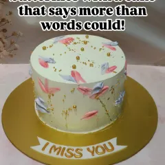 A cake that says "I Miss You" more than words can. This elegant design features a delicate butterfly motif painted with buttercream, perfect for bridging any distance.