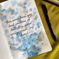"One word from you and millions of butterflies grow wings inside my heart." I used a wet-on-wet watercolor technique to create a dreamy, abstract background of butterflies for this romantic quote.