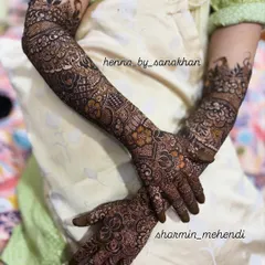A full bridal mehndi set, showcasing the continuity of the design from the palms up to the elbows. This is a classic example of my comprehensive bridal work.
