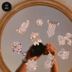 Our diamond-style brooches are conversation starters. This collection features intricate designs like feathers, bows, and snowflakes, all crafted to add a touch of sparkling elegance. These are limited pieces with unlimited compliments.
