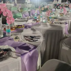 A beautifully set table at a wedding we catered at the ASC Centre. We provide complete service, including floral arrangements and coordinated table settings for a formal dinner.
