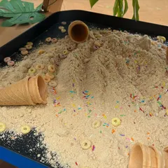 This taste-safe "ice cream" sand, made from flour and decorated with sprinkles, was part of our Gruffalo party. It's perfect for scooping into cones and cupcake liners, encouraging imaginative play.
