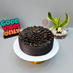 One of our bestseller designs. This rich chocolate truffle cake is decorated with a beautiful petal effect, created using a simple piping technique.