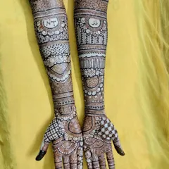 It was an honor to do this bridal henna for my cousin. I included her and her partner's initials, 'NT', in a special band on her arms.