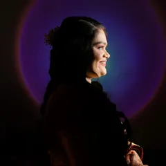 A creative silhouette portrait using a sunset lamp to create a colorful halo effect. This technique produces a unique and artistic image that stands out from traditional portraits.