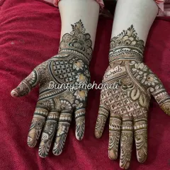 A beautiful back-hand design with a mix of bold and fine lines, featuring a peacock and the name 'Suhaib'.
