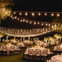 A classic and romantic outdoor reception setup. The entire area is lit by strings of star-shaped fairy lights, creating a warm and inviting atmosphere for dinner and dancing.