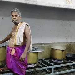 Our head cook, continuing the family parampara, prepares a large batch of food in traditional brass vessels. We wear the panche to honour our heritage and bring a complete cultural experience to your event.