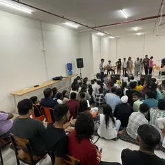 A full house at our Seekho Showcase. This image shows the packed, supportive audience that comes to cheer on our students, creating an electric atmosphere of encouragement and community spirit.