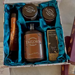 A look inside a grooming hamper curated for the groom. I styled this set of Tailor's products in a custom box with rich teal satin, ensuring the gift felt luxurious and personal.