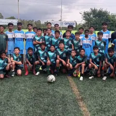 Our U13 boys team posing with Kickstart FA before an 11-a-side friendly match. These games are crucial for developing teamwork and discipline.