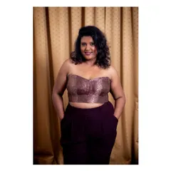 Feeling confident in a custom-made corset. I designed this brocade corset top and paired it with tailored trousers for a modern, edgy look. I can create bespoke corsets and western wear that fit you perfectly.
