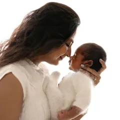 An Eskimo kiss between mother and baby. These are the sweet, simple interactions that create the most heartwarming portraits.