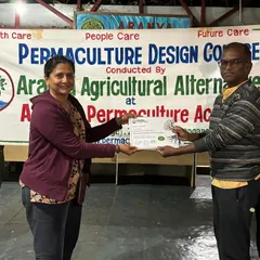 Here I am receiving my Permaculture Design certification. This training has deeply influenced my approach to gardening, emphasizing care for the earth, care for people, and sharing resources fairly.