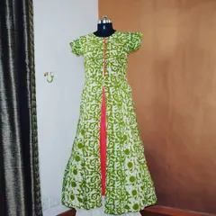 A fresh green and white block-printed kurta with a front slit that reveals a pop of bright pink. This design is breezy, comfortable, and adds a playful touch to your wardrobe.