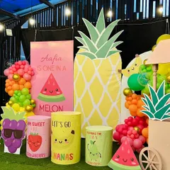 Aafia is 'One in a Melon'. This vibrant, fruit-themed party featured giant pineapple and watermelon cutouts, along with fun, character-faced fruit props and a colorful balloon garland.