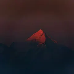 The last rays of the setting sun kiss a single peak in Ranikhet, turning it a fiery red. This fleeting moment, captured with my Canon 80D, shows the dramatic, painterly light the mountains offer.