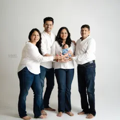 Welcoming a new baby is a celebration for the whole family. We create timeless group portraits that include parents, siblings, and grandparents, capturing that first special bond with the newest family member.