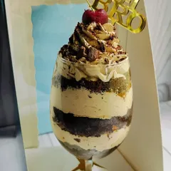 My Mocha Mirage Delight, created specially for Rakhi. It's an elegant dessert glass layered with chocolate cake, coffee mousse, almond praline, caramel, and chocolate chunks.