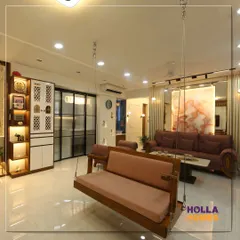 An indoor swing or 'jhoola' adds a touch of tradition and fun to a modern living room. This space, designed with a Maharashtrian theme, combines neutral tones with classic elements for a serene and elegant feel.