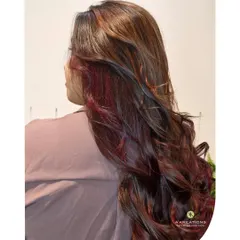 A back view of the magenta-red balayage, showing the seamless blend of colors and the healthy shine of the hair.