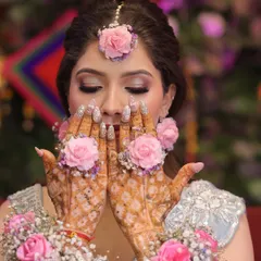 A close-up on the beautiful mehndi and the soft, shimmery eye makeup.