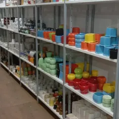 Our shelves are stocked with colorful ceramic pots, from bright yellows and reds to cool blues and greens, perfect for tabletop plants and succulents.