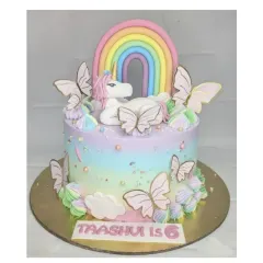 A magical unicorn and butterfly cake with a chocolate truffle base. I love the pastel rainbow frosting, the fondant unicorn, and the delicate butterfly details on this custom birthday cake.