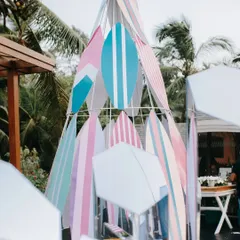For a beach destination wedding, we created this cool installation using surfboards in subtle pastel hues. It served as a fun photo booth and an interesting visual experience that perfectly matched the vibe.