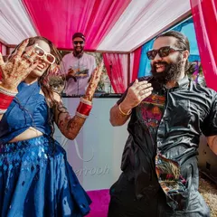 High-energy dancing at a Goa pool party, with the couple showing off their moves and enjoying the celebration with their guests.
