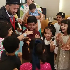 The pure joy and wonder on kids' faces during one of our magic shows. We arrange for professional magicians who captivate the audience with their amazing tricks, adding an extra layer of excitement to any birthday party.