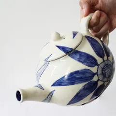 My 'Bloom & Brew' teapot is designed for those who cherish their tea rituals. The bold, hand-painted indigo florals on the off-white ceramic body turn a simple daily routine into a moment of beauty and slow living.