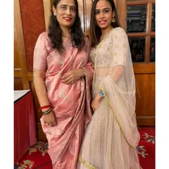 A lovely mother-daughter duo. I designed a fully hand-embroidered lehenga for the daughter and a complementary silver-embroidered blouse for her mother's elegant pink saree.
