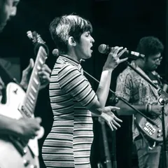 A shot from a full band concert. This setup, with guitars, bass, drums, and keyboards, allows us to explore a wide range of genres from rock and funk to soul and pop.