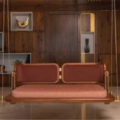 A closer look at the custom-designed reversible swing, a signature piece from my 'Objects by Soch' collection. This piece exemplifies my commitment to craftsmanship, combining the warmth of teak wood with elegant brass fixtures and plush upholstery to create functional art.
