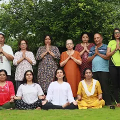 A happy group photo after a rejuvenating outdoor yoga class. It’s always a joy to see so many smiling faces connected through the practice of yoga.